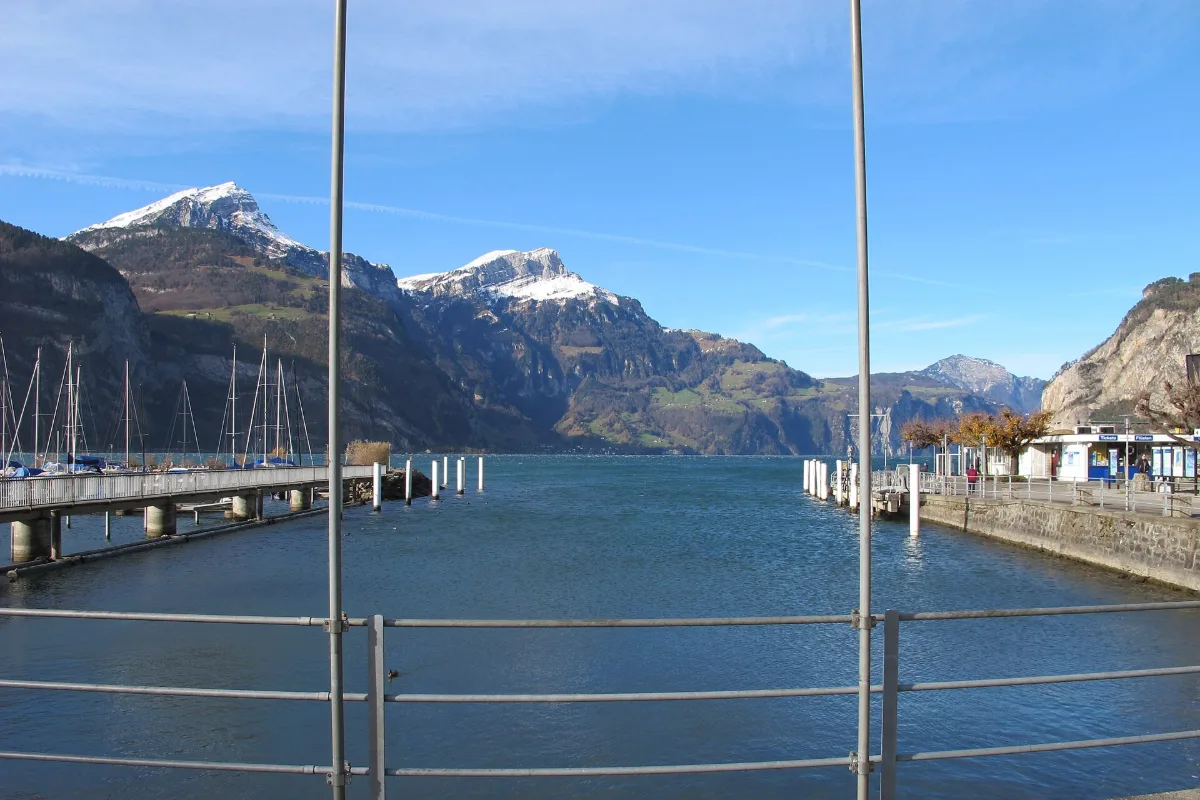 Flüelen landing stage at the southern end of Lake Lucerne with snow-capped Urner Alps behind