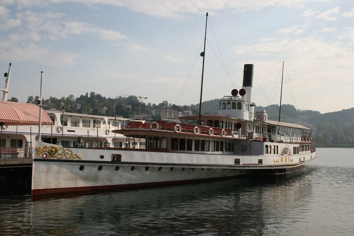 Historic paddle steamer Uri moored at a Lucerne pier before departure