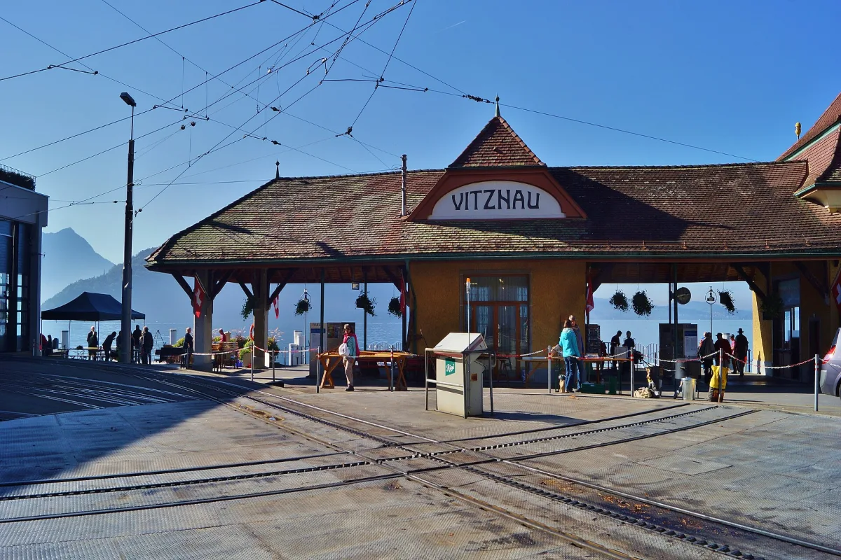 Vitznau boat station with the Rigi cogwheel railway tracks running in front of it
