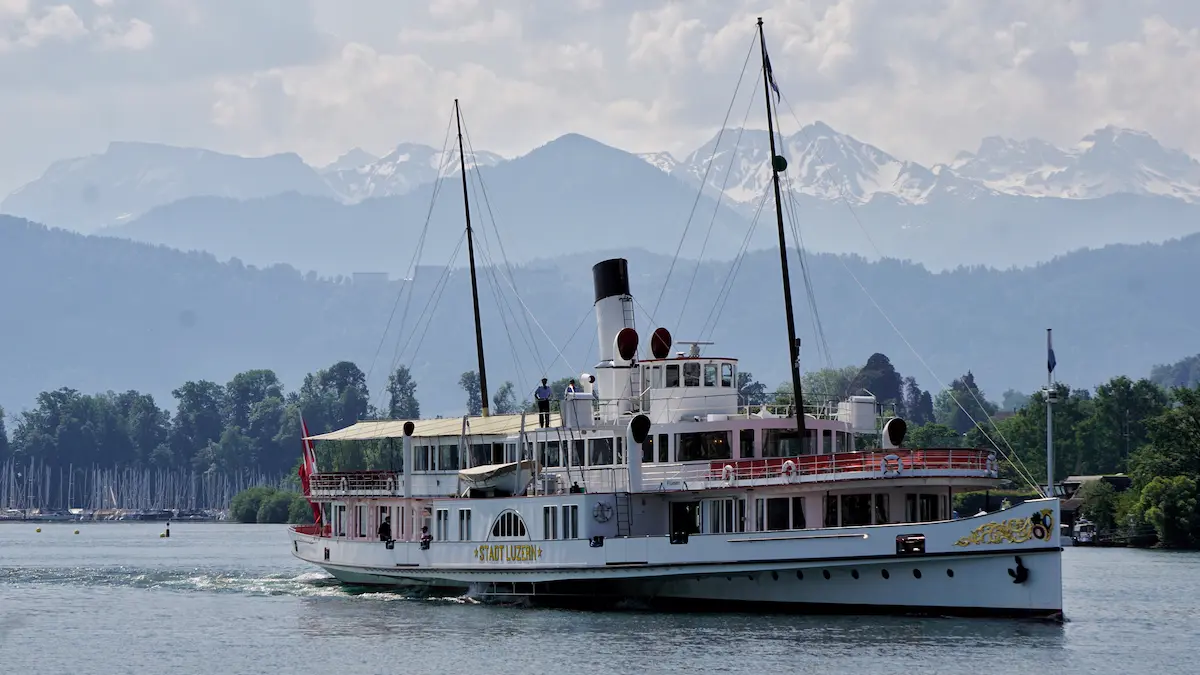Stadt Luzern paddle steamer on Lake Lucerne with mountains behind