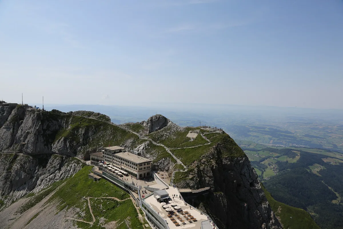 Pilatus Kulm summit buildings on a rocky ridge above the valley