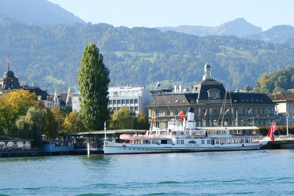 Paddle steamer Stadt Luzern moored at the Lucerne quay on Lake Lucerne, a scheduled boat service included with the Swiss Travel Pass and only discounted with the Half Fare Card
