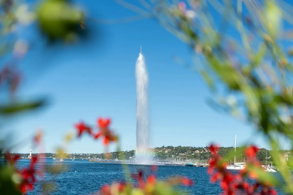 Geneva’s Jet d’Eau framed by flowers along the lakefront