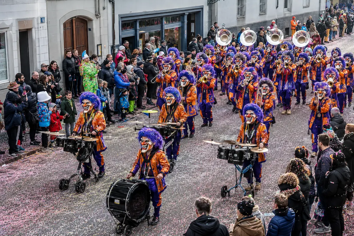 AI-generated daytime illustration of a colorful Guggenmusik group performing during Basel Carnival.