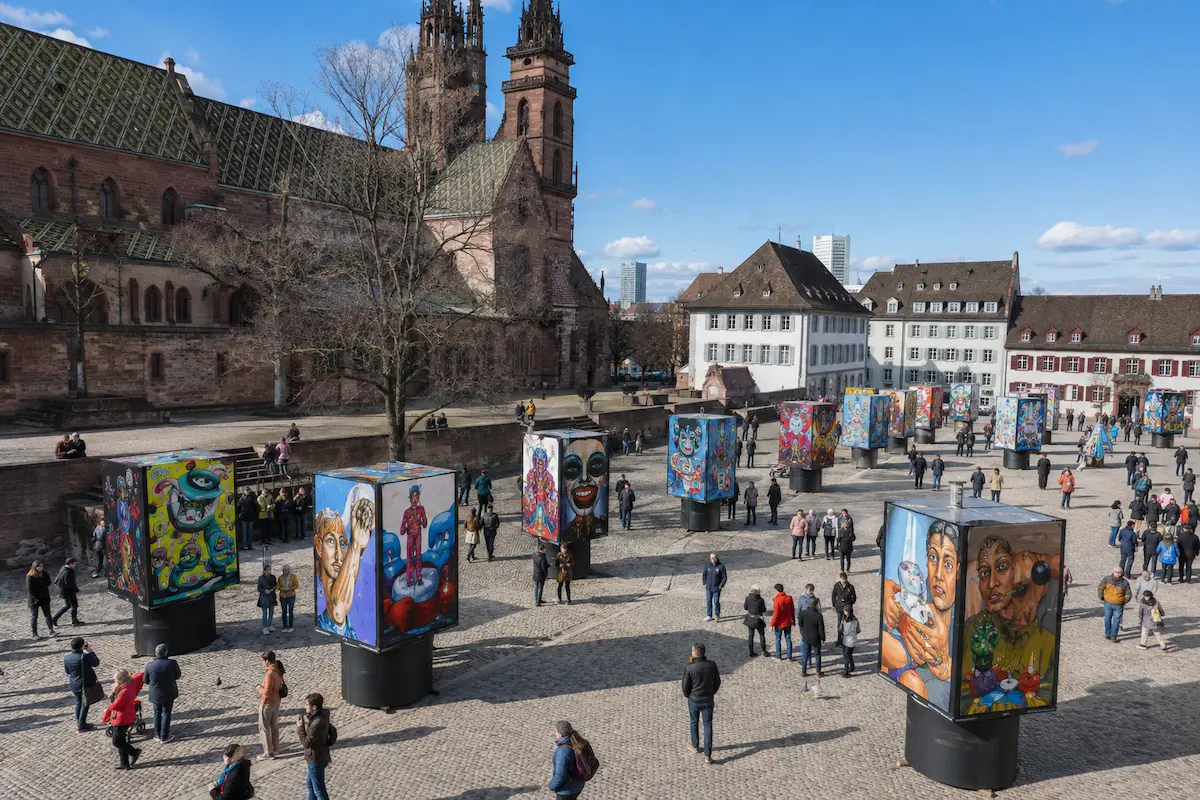 AI-generated daytime illustration of colorful carnival lantern displays in a Basel square.