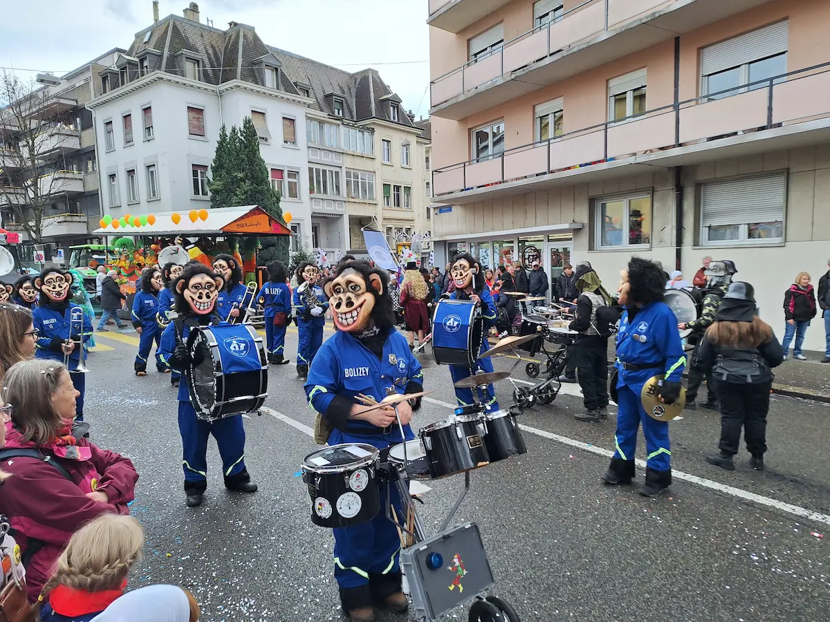 Carnival lanterns displayed beside Basel Minster during Basel Fasnacht 2025.