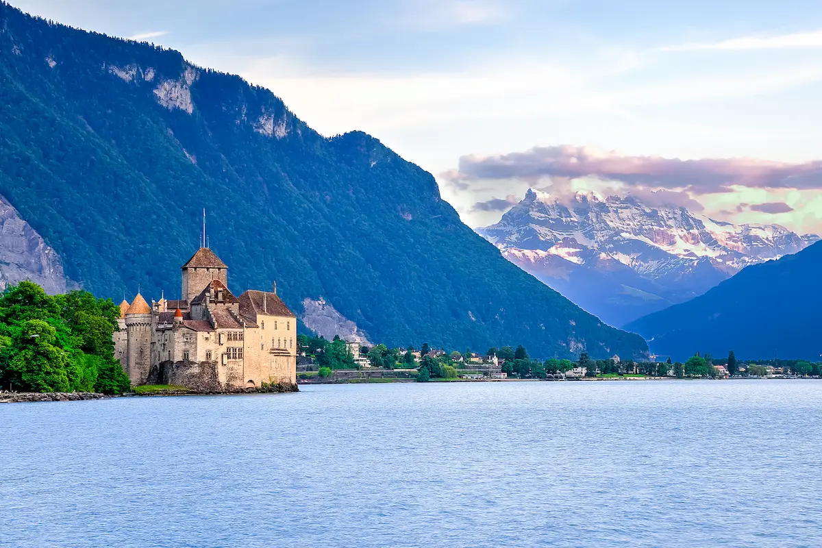 Chillon Castle beside Lake Geneva with the Alps in the background