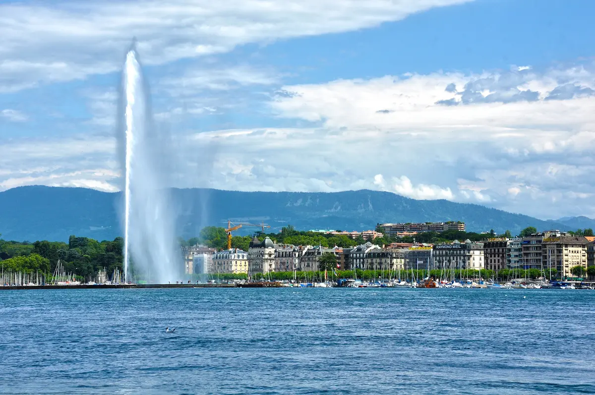 Geneva waterfront and Jet d’Eau seen across Lake Geneva