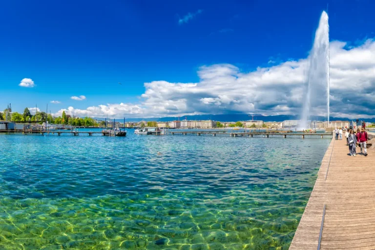 Lake Geneva waterfront with the Jet d’Eau and a pedestrian promenade