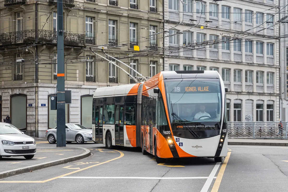 TPG articulated trolleybus traveling on a street in Geneva