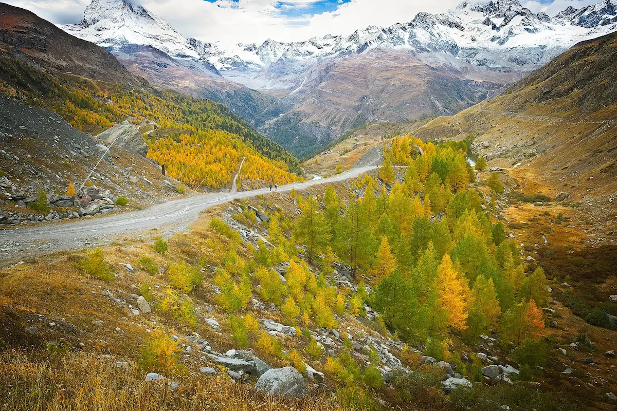 Autumn mountain landscape and walkers near Zermatt
