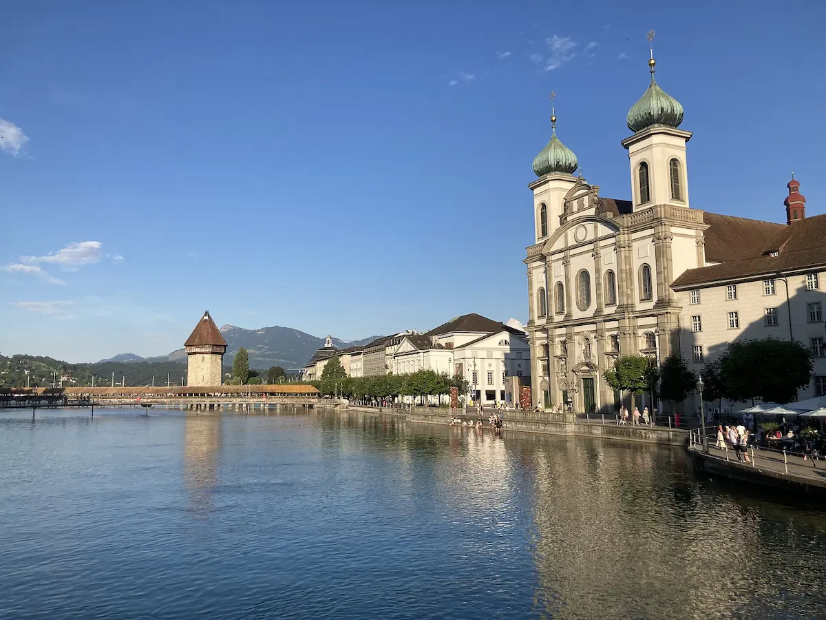 Chapel Bridge and the Jesuit Church beside the Reuss River in Lucerne