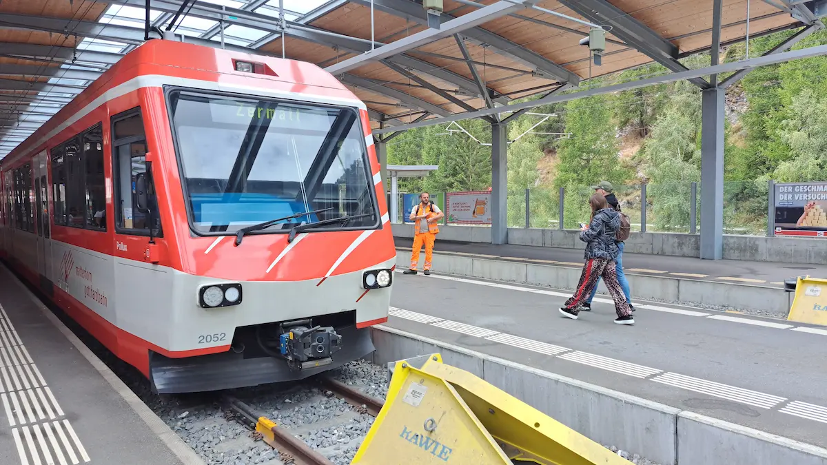 Matterhorn Gotthard Bahn shuttle train at the covered platform in Täsch station