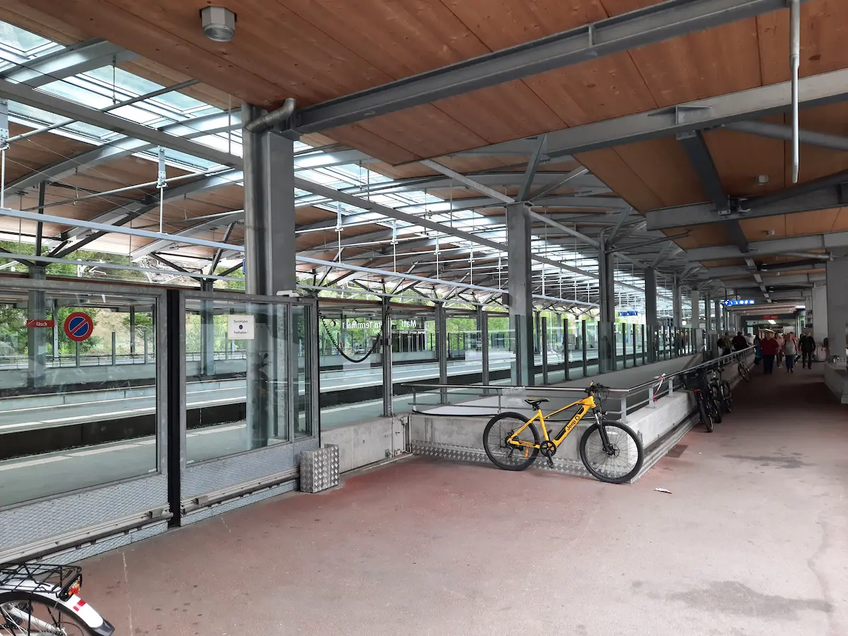 Covered passenger walkway beside the platforms at Täsch railway station