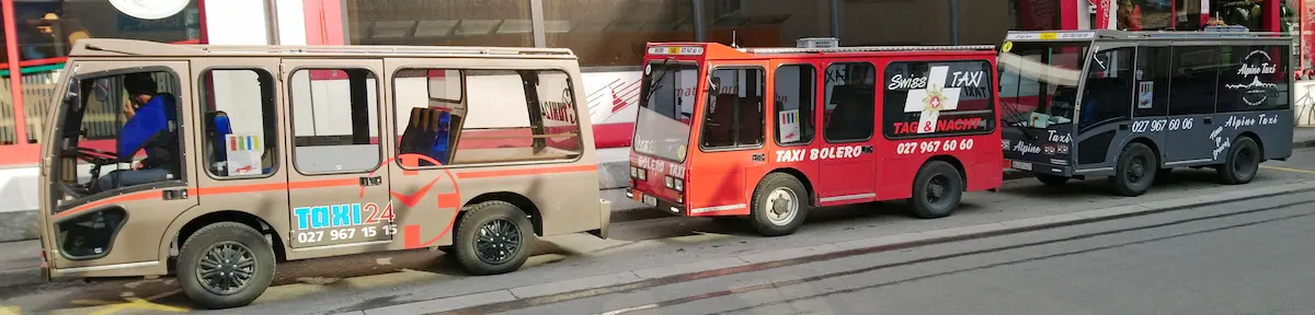 Three electric taxi vehicles in Zermatt