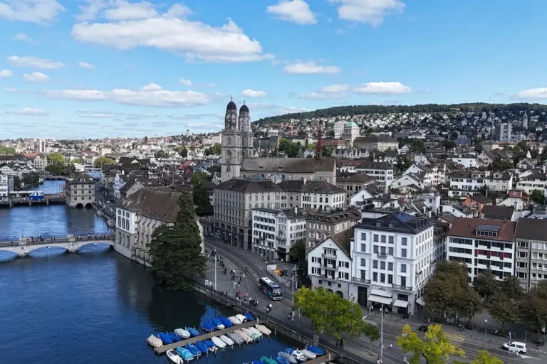 Aerial view of Zurich, the Limmat River and historic buildings under a blue sky